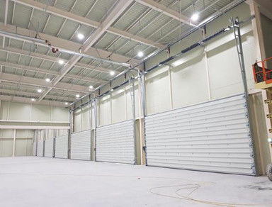 Αγορά Αποθήκη Βιομηχανικές διατομικές πόρτες Αυτοματοποιημένες εμπορικές ατσάλινες διατομικές πόρτες online manufacture